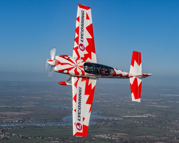plane flying sideways on an aerobatic flying experience