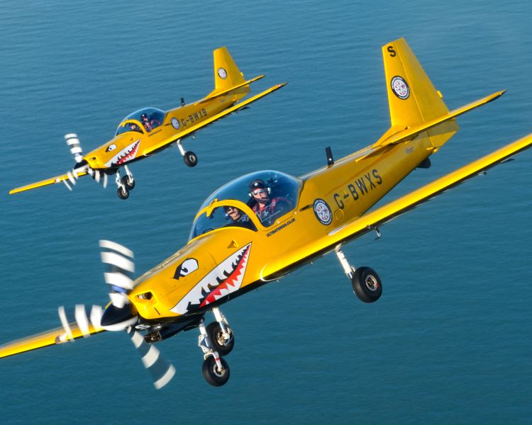 two planes flying over sea on top gun flying experience