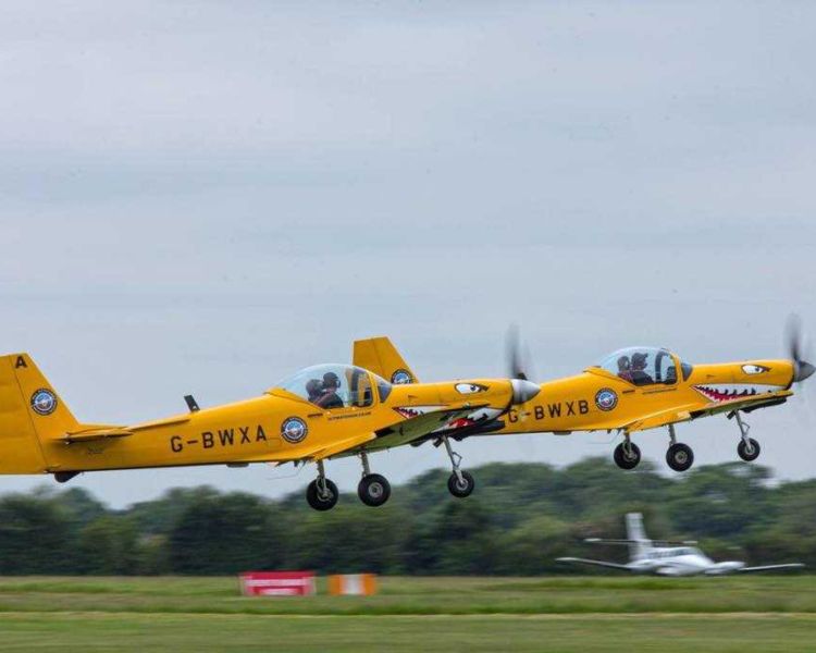 two planes taking off on top gun flying experience