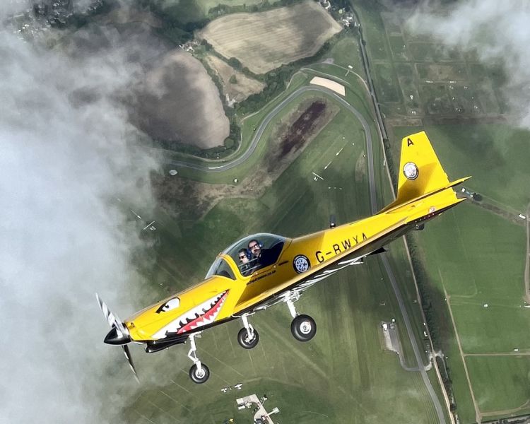 plane seen through clouds on fighter pilot flying experience