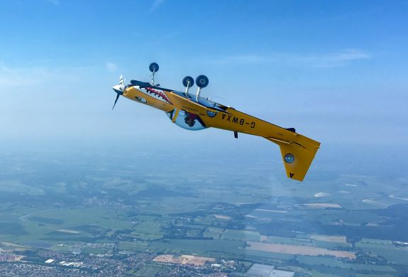 plane upside down in sky on fighter pilot flying experience