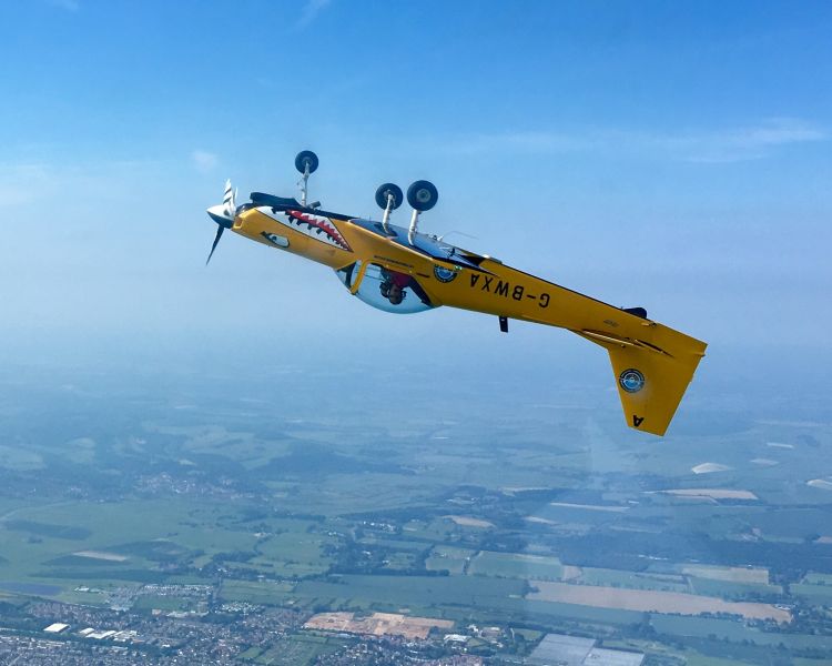 plane upside down in sky on fighter pilot flying experience