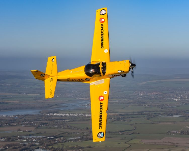 yellow plane in sky on a fighter pilot flying experience