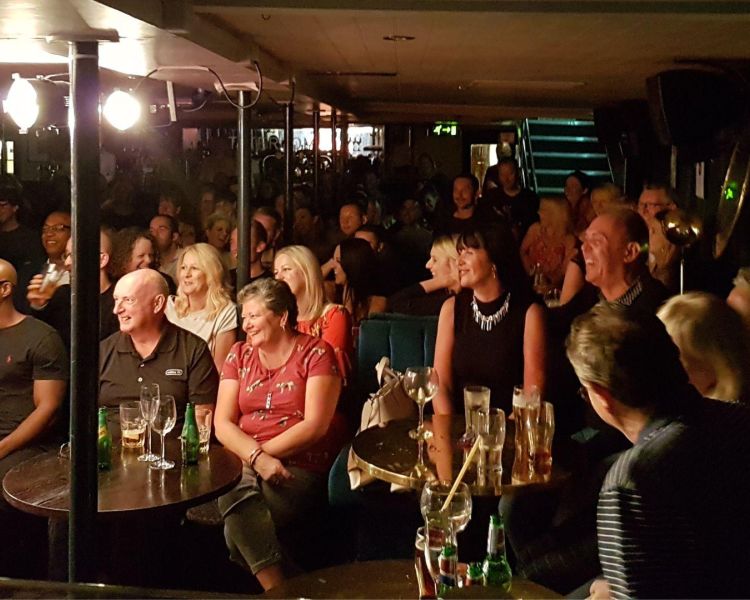 audience watching comedians at the boat show comedy club in london