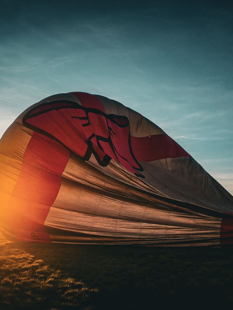 Packing the hot air balloon away at sunset