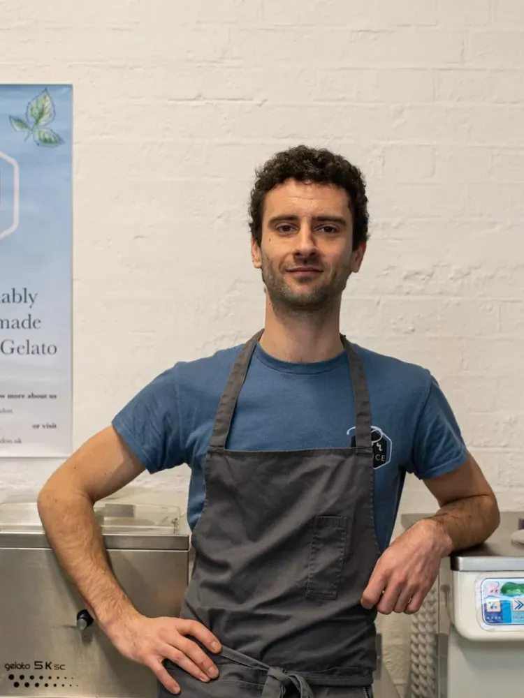 man standing in front of ice cream mixers on a make your own gelato from scratch workshop in london