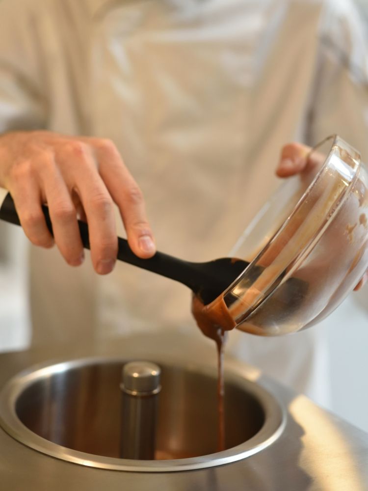 ingredients being poured into a mixer on a make your own gelato from scratch workshop in london