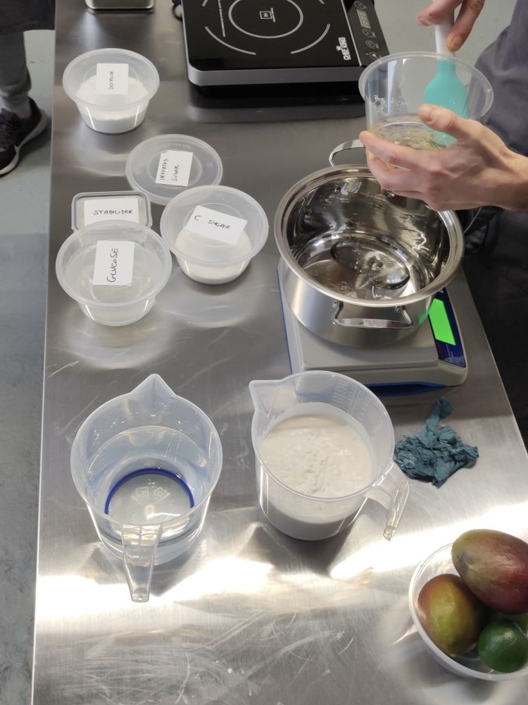 someone working at a work bench on a make your own gelato from scratch workshop in london