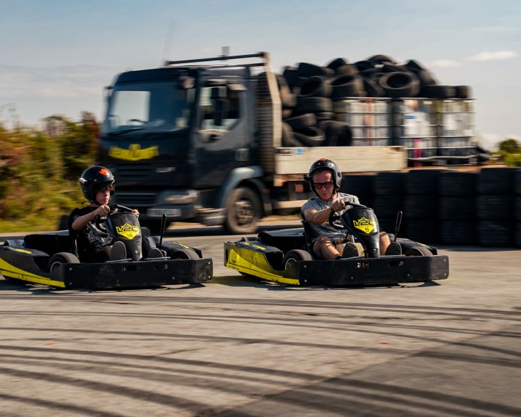 man and boy on drift karting experience going around track
