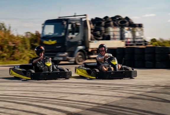 man and boy on drift karting experience going around track