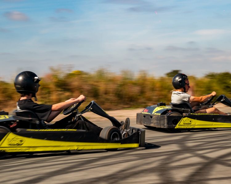man and boy on drift karting experience going around track