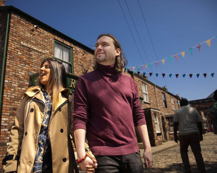 A couple take in Coronation Street