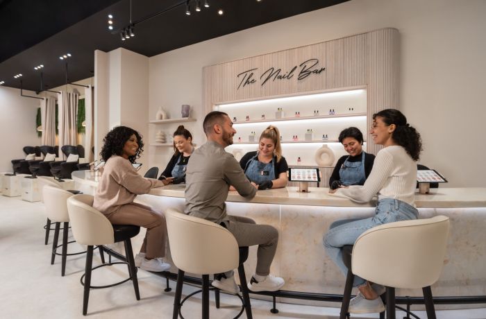 ladies and men having nail treatments at a townhouse nail salon
