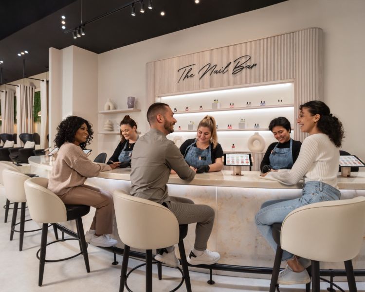 ladies and men having nail treatments at a townhouse nail salon