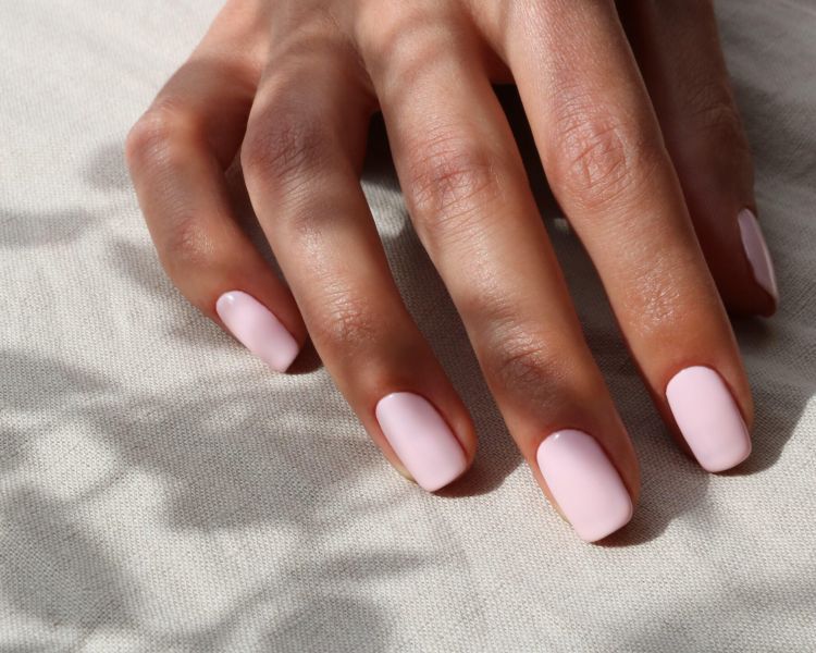 nails painted with soft pink gel polish at townhouse nail salon