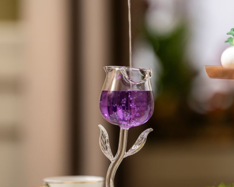 purple cocktail for a midsummer nights dream afternoon tea at Kona, Taj 51 Buckingham Gate