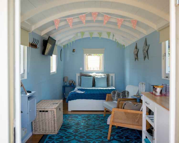 interior of standard shepherds hut on glamping site in dorset