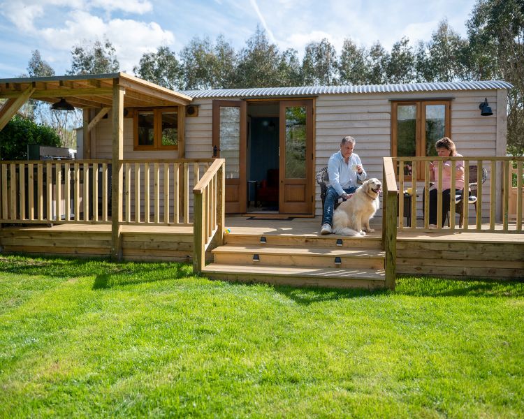 exterior of ensuite shepherd hut at glamping site in dorset