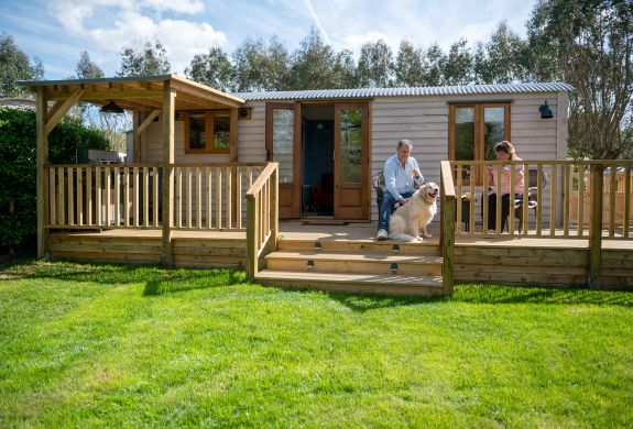 exterior of ensuite shepherd hut at glamping site in dorset