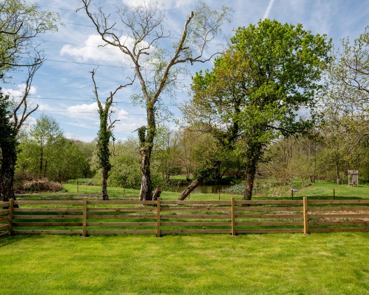 private garden of ensuite shepherd hut at glamping site in dorset