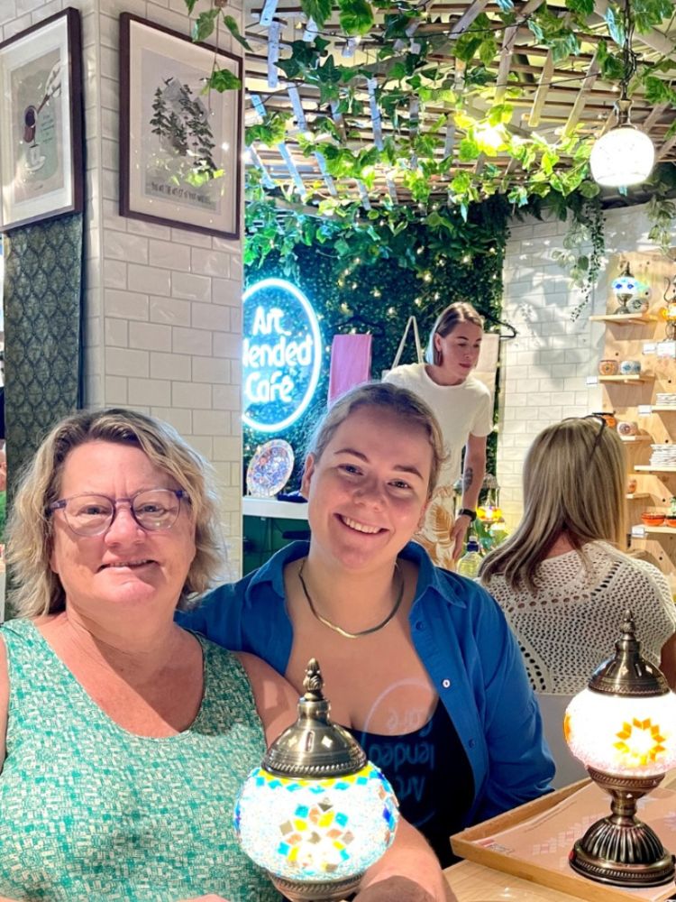 Two ladies at mosaic lamp making workshop