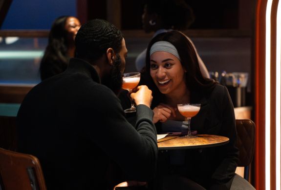 Couple at table with cocktails at the lucky goat