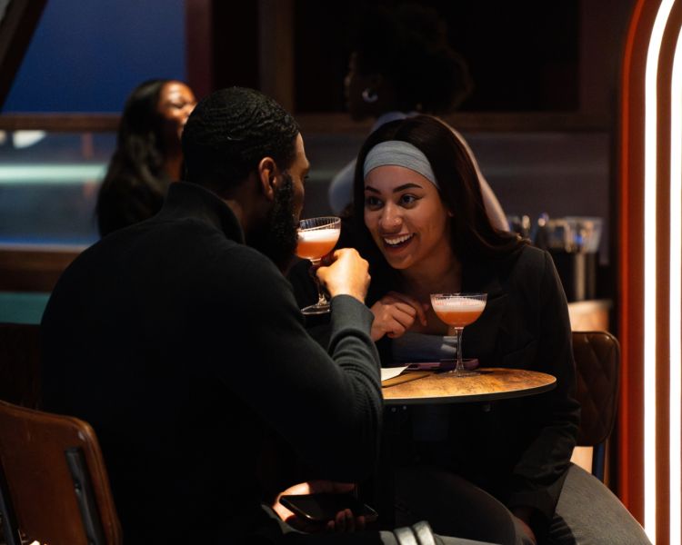 Couple at table with cocktails at the lucky goat