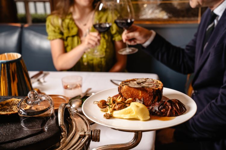 couple at luxury restaurant drinking wine