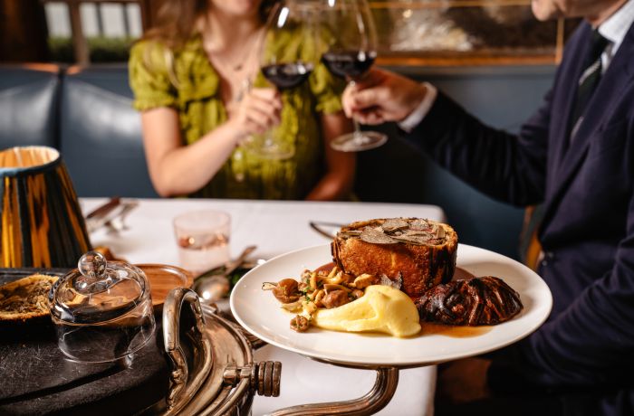 couple at luxury restaurant drinking wine