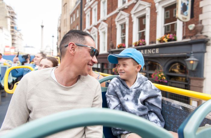 man and son on the original london kids tour bus