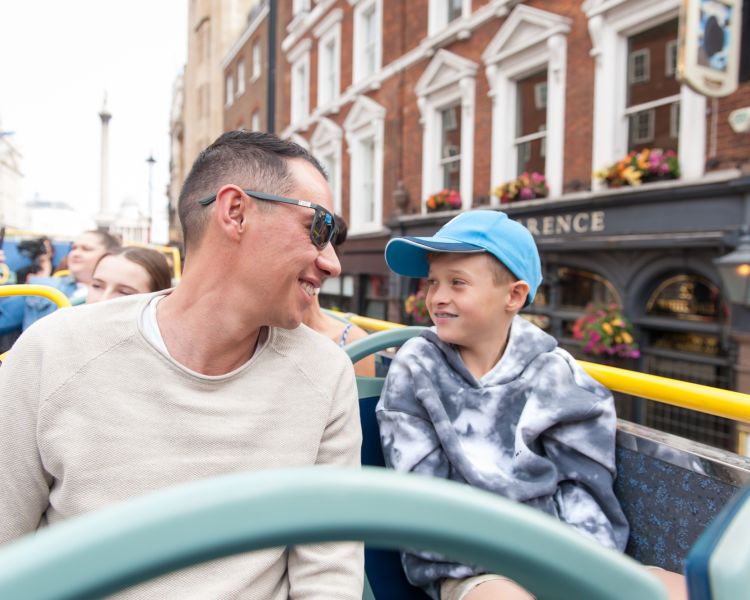 man and son on the original london kids tour bus