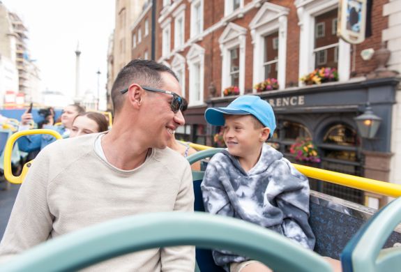 man and son on the original london kids tour bus