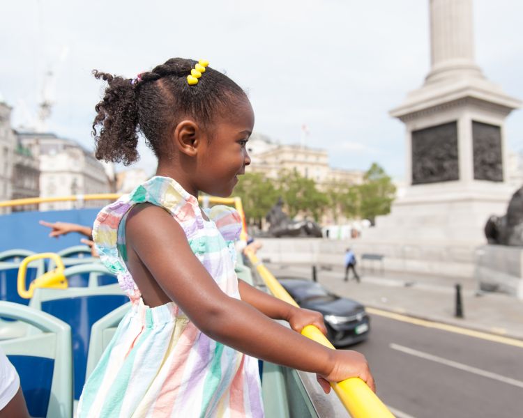 young girl on top deck of kids london bus tour