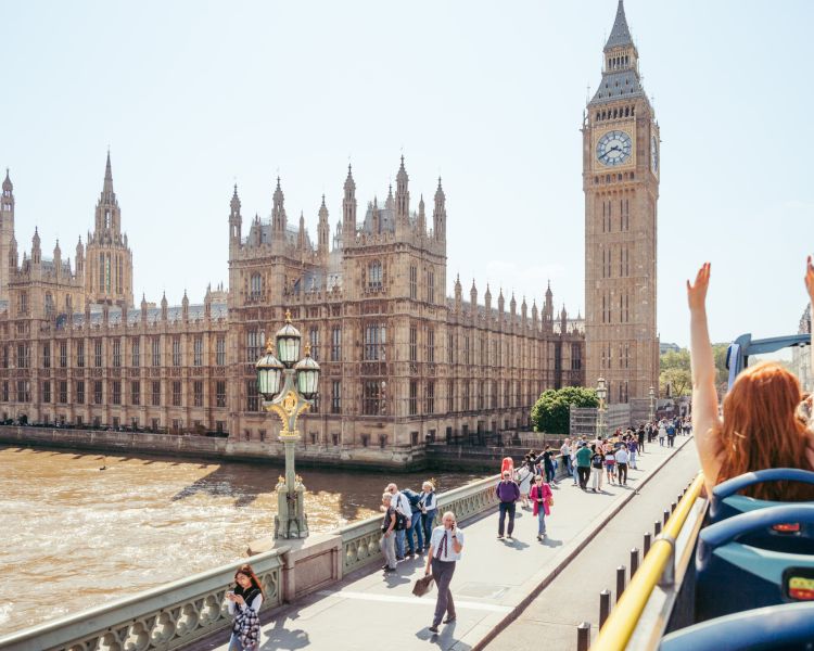 view from top deck of the original london bus tour going past houses of parliament