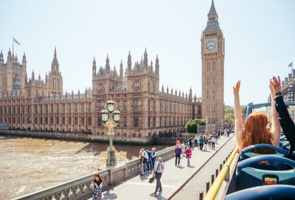 view from top deck of the original london bus tour going past houses of parliament