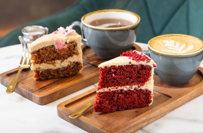 Two pieces of cake with tea and coffee at jack and beyond