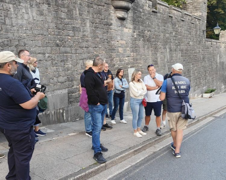 group listening to guide on the arundel historic walking tour