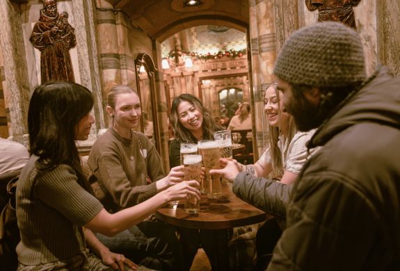 Group with beers in pub on london pub tour