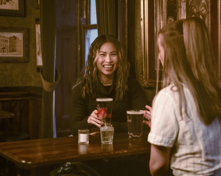 Drinking beer in pub on london pub tour