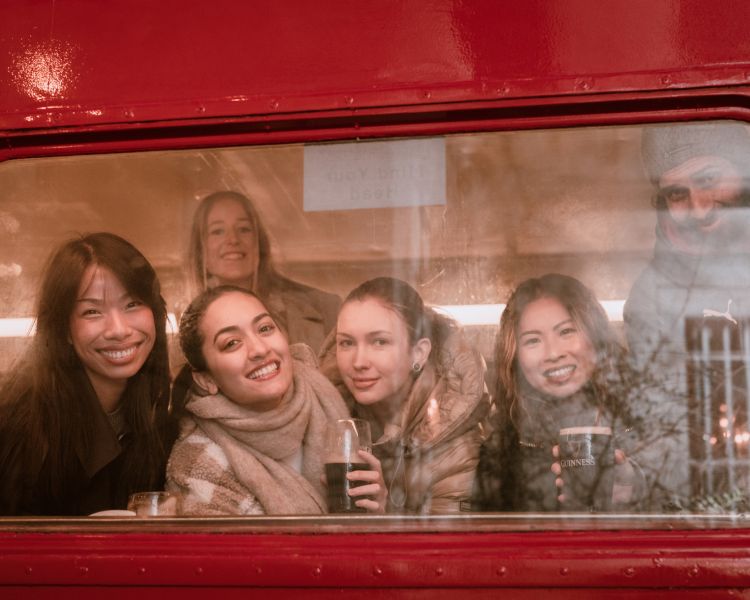 Looking out bus window on london pub tour