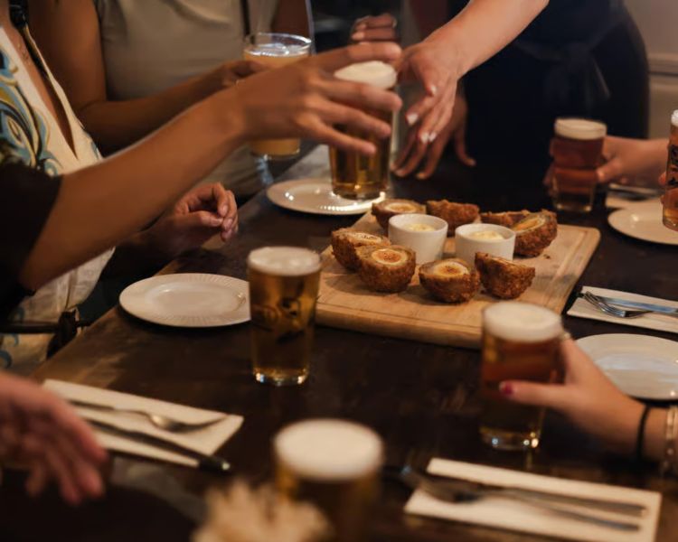 Beers and scoth eggs enjoyed on london pub and food tour