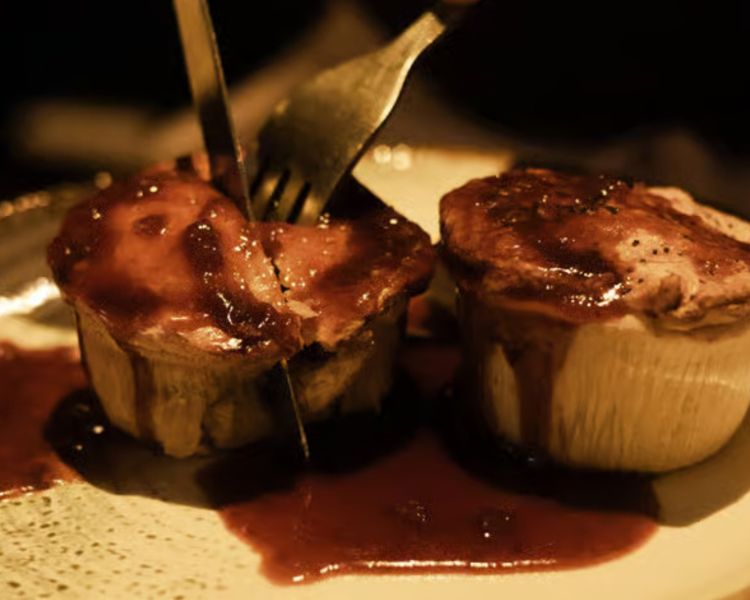 Cutting into pies on london pub and food tour