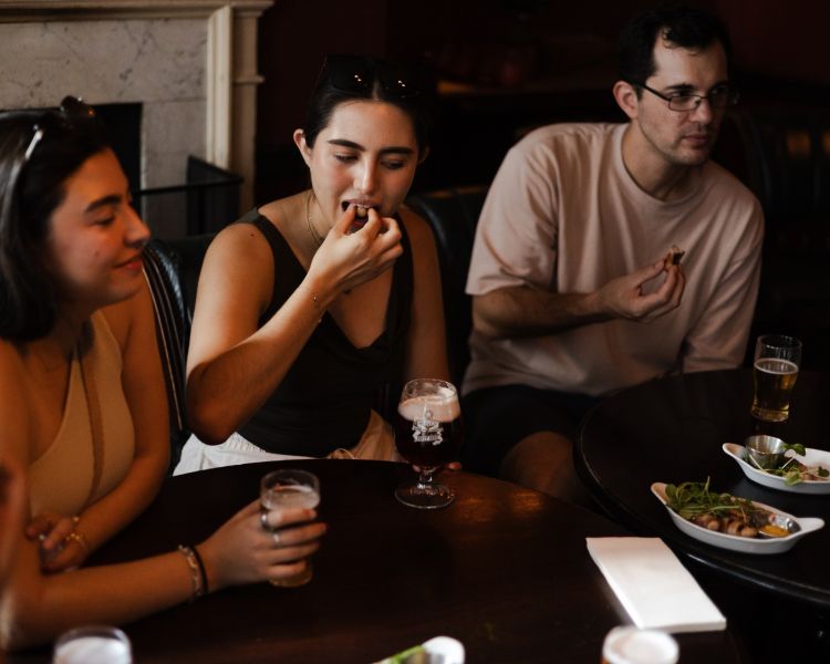 Trying pub snacks on london pub and food tour