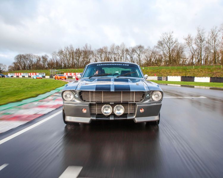 a front view of a classic car on a race track as part of a driving experience day
