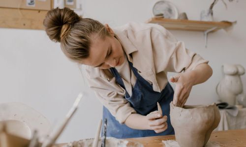 women making something out of clay on a pottery experience day