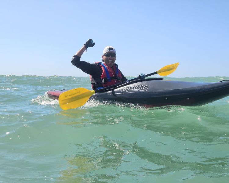 man in kayak on kayaking experience off brighton coast