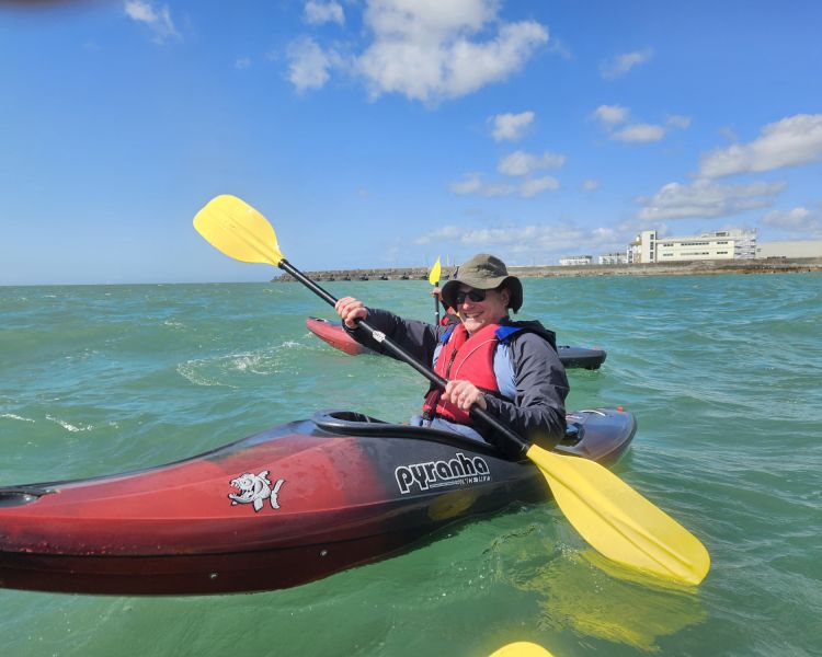man in kayak on kayaking experience off brighton coast