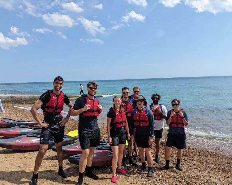 group shot on beach on kayaking experience off brighton coast