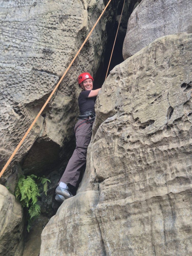 person on cliff on rock climbing experience in sussex and kent