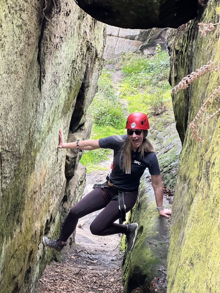 woman having fun on rock climbing experience in sussex and kent